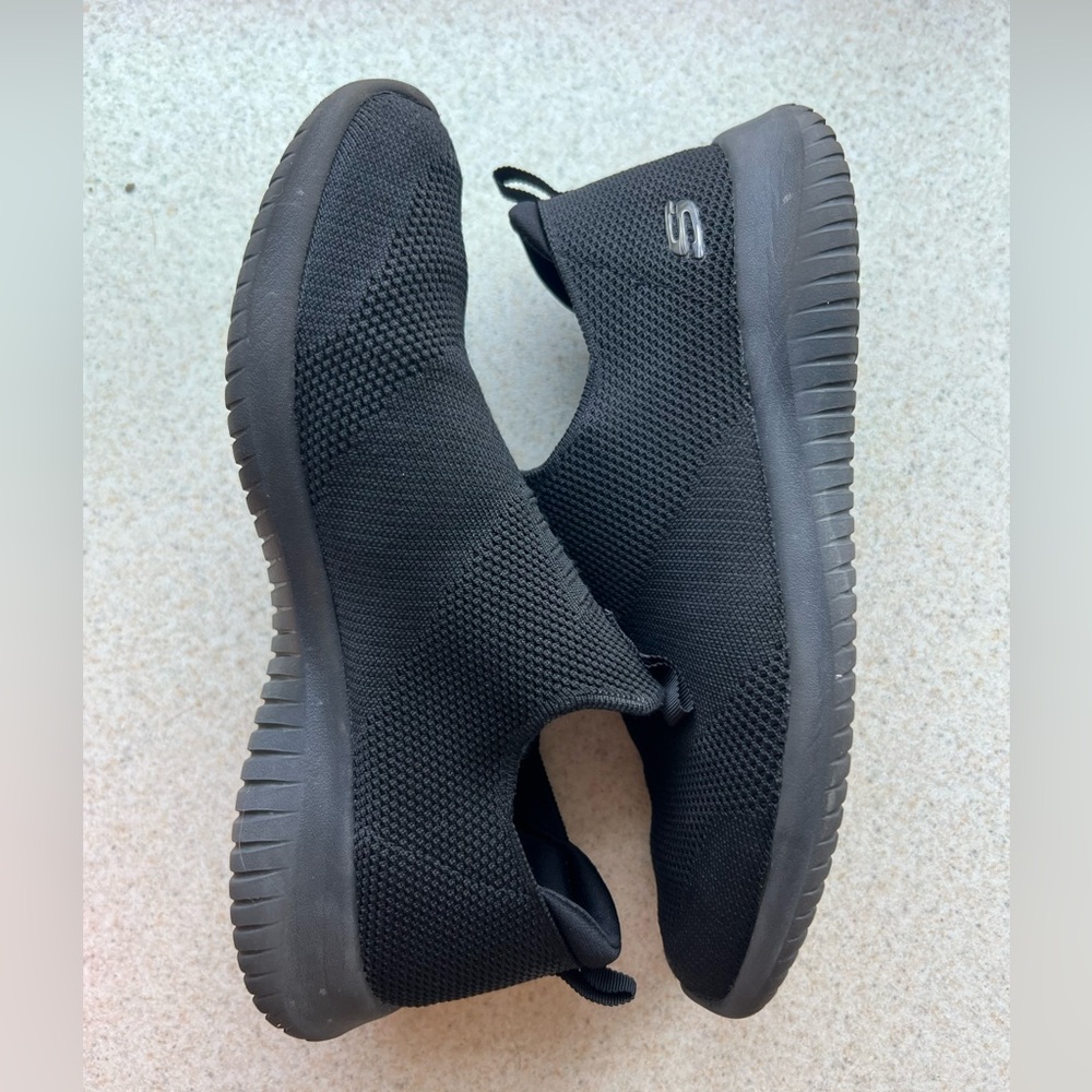 Black sketcher shoes